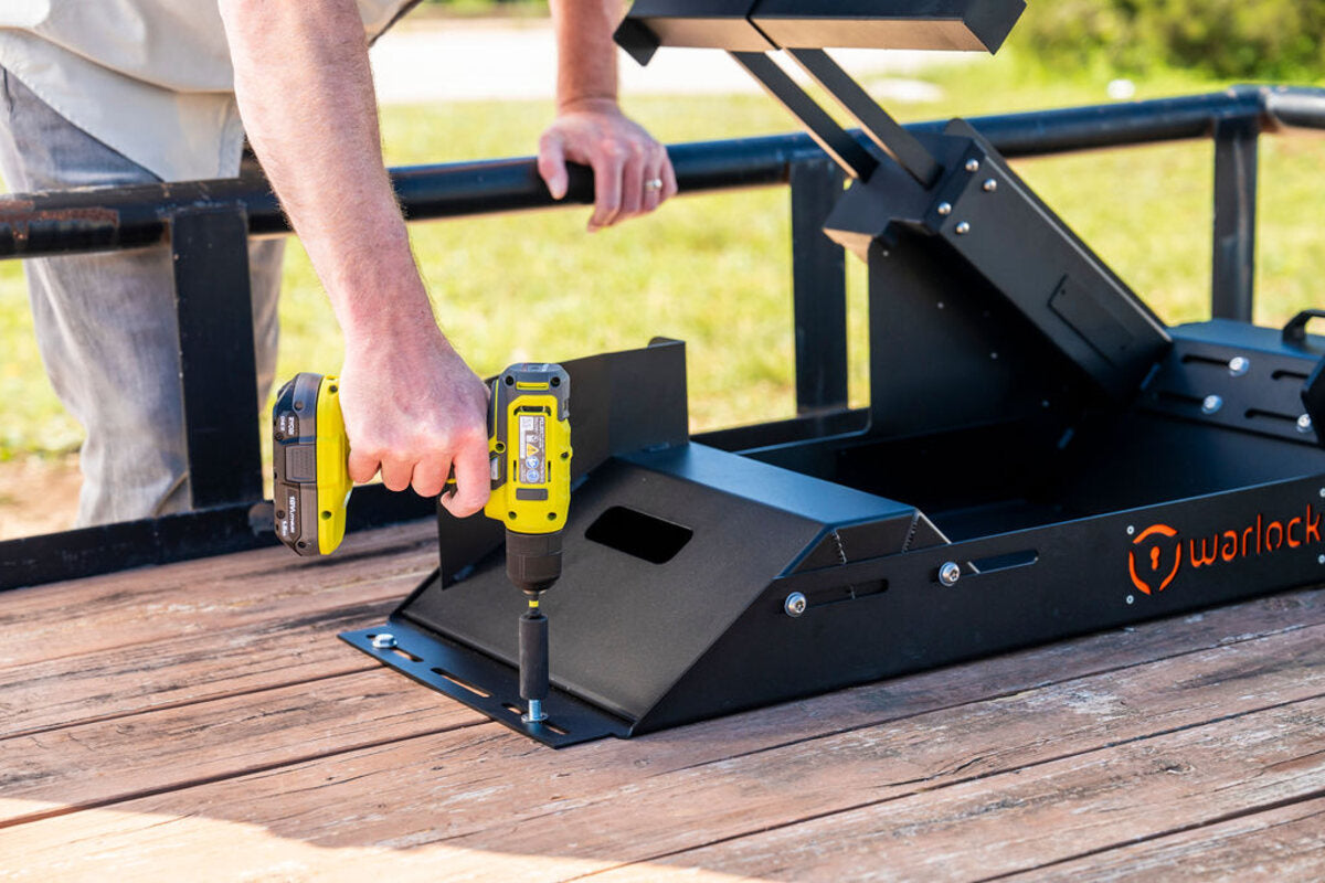 Bolting the Warlock to a wooden trailer deck with an impact driver